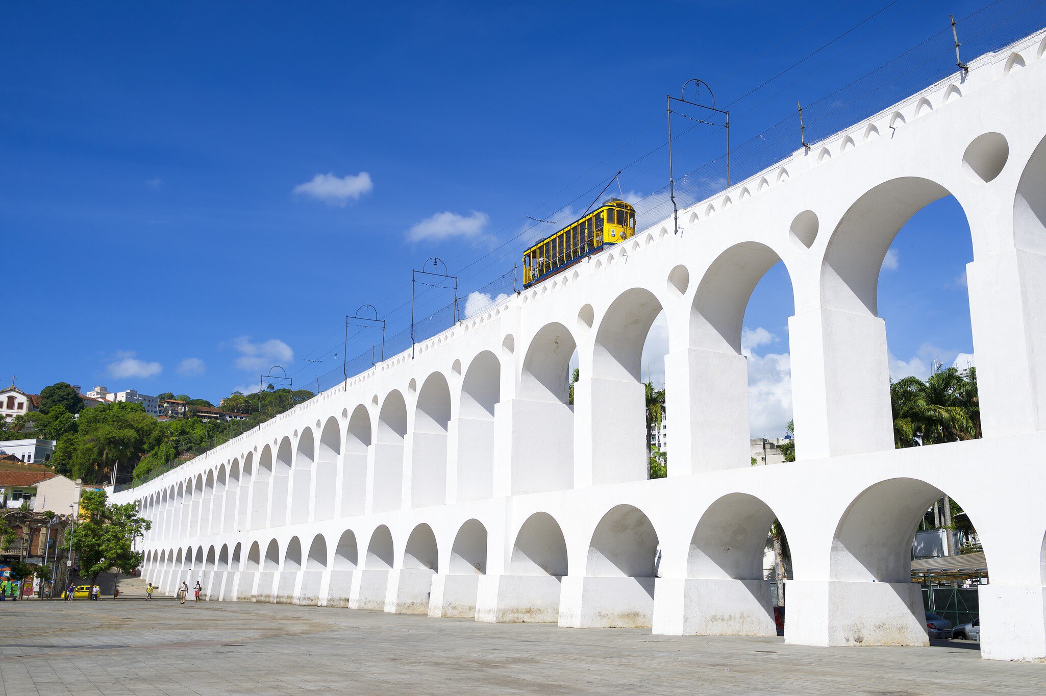 Bonde de Santa Teresa tram train drives along distinctive white arches of the landmark Arcos da Lapa in Centro of Rio de Janeiro Brazil, License Type: media, Download Time: 2025-02-02T23:15:41.000Z, User: Ppeterson948, Editorial: false, purchase_order: 56530 - Guidebooks, job: Global Publishing WIP, client: Global Publishing WIP, other: Pia Peterson Haggarty