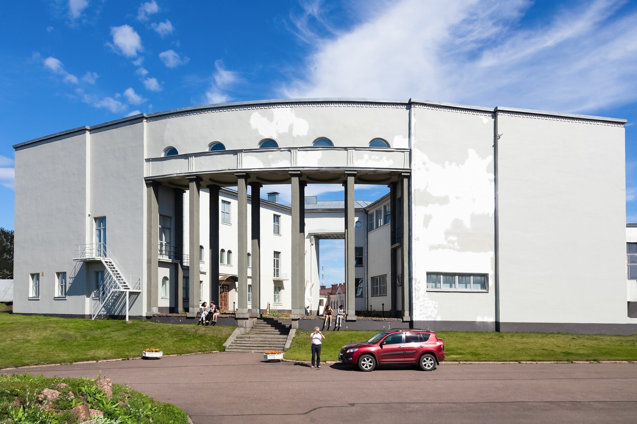 Hermitage-Vyborg - branch of State Hermitage, exhibition center, sunny summer day, people walking - Vyborg, Russia, August 2022; Shutterstock ID 2188134475;