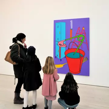 Visitors viewing a painting by Michael-Craig Martin on display at the Saatchi Gallery in London, UK.