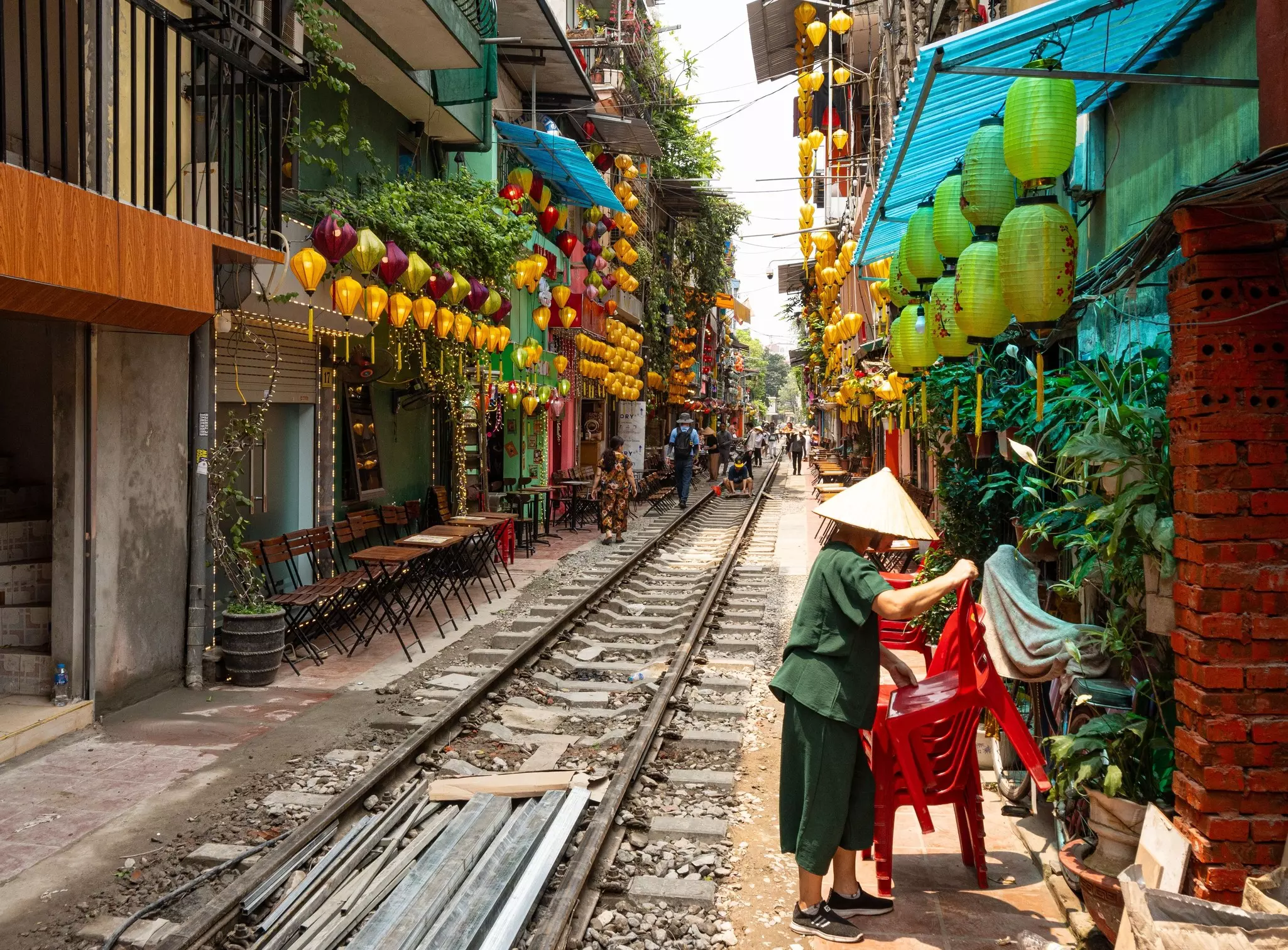 Hanoi Vietnam - April 24 2024 : the colourful empty train street in Hanoi city at daytime in Vietnam with a few local people and tourist. Hanoi Old Quarter where trains passing through the houses., License Type: media, Download Time: 2025-01-29T18:09:38.000Z, User: katelyn.perry_lonelyplanet, Editorial: true, purchase_order: 65050 - Digital Destinations and Articles, job: Lonely Planet WiP, client: Lonely Planet WiP, other: KP