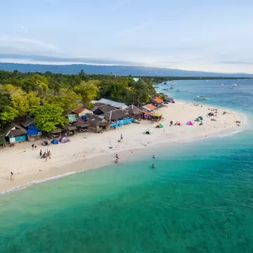 White Beach Moalboal in Cebu, Palawan, Philippines. Boat and Ocean Water and Beach.; Shutterstock ID 1043799535;
