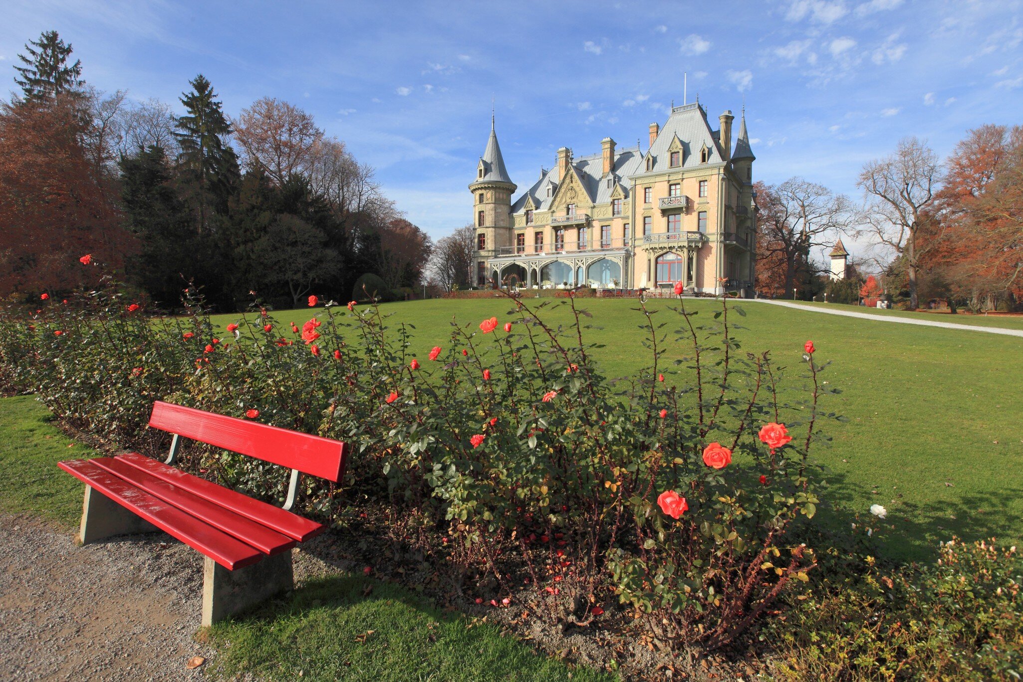 beautiful castle and garden on the shore of Lake Thun, Switzerland ; Shutterstock ID 556784830;