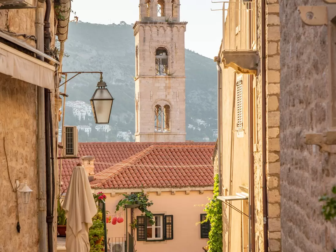 Bell tower of Dominican Monastery view from Dubrovnik old town street in Croatia summer morning, License Type: media, Download Time: 2026-02-23T21:44:42.000Z, User: LP_YKhanna, Editorial: false, purchase_order: 65050 - Digital Destinations and Articles, job: LP, client: App Content, other: Yuvraj Khanna