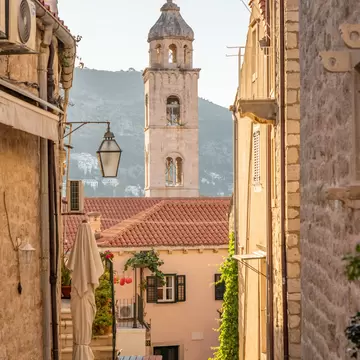 Bell tower of Dominican Monastery view from Dubrovnik old town street in Croatia summer morning, License Type: media, Download Time: 2026-02-23T21:44:42.000Z, User: LP_YKhanna, Editorial: false, purchase_order: 65050 - Digital Destinations and Articles, job: LP, client: App Content, other: Yuvraj Khanna