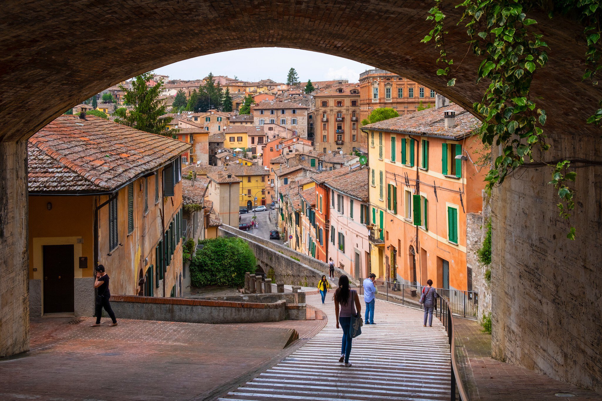 Perugia, Umbria / Italy - 2018/05/28: Panoramic view of the historic aqueduct forming Via dell Acquedotto pedestrian street along the ancient Via Appia street in Perugia historic quarter   License Type: media  Download Time: 2021-03-16T01:57:17.000Z  User: mvm_lonelyplanet  Is Editorial: Yes  purchase_order: