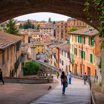 Perugia, Umbria / Italy - 2018/05/28: Panoramic view of the historic aqueduct forming Via dell Acquedotto pedestrian street along the ancient Via Appia street in Perugia historic quarter   License Type: media  Download Time: 2021-03-16T01:57:17.000Z  User: mvm_lonelyplanet  Is Editorial: Yes  purchase_order:
