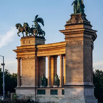 View of Heroes' Square in Budapest, Hungary, at sunset.