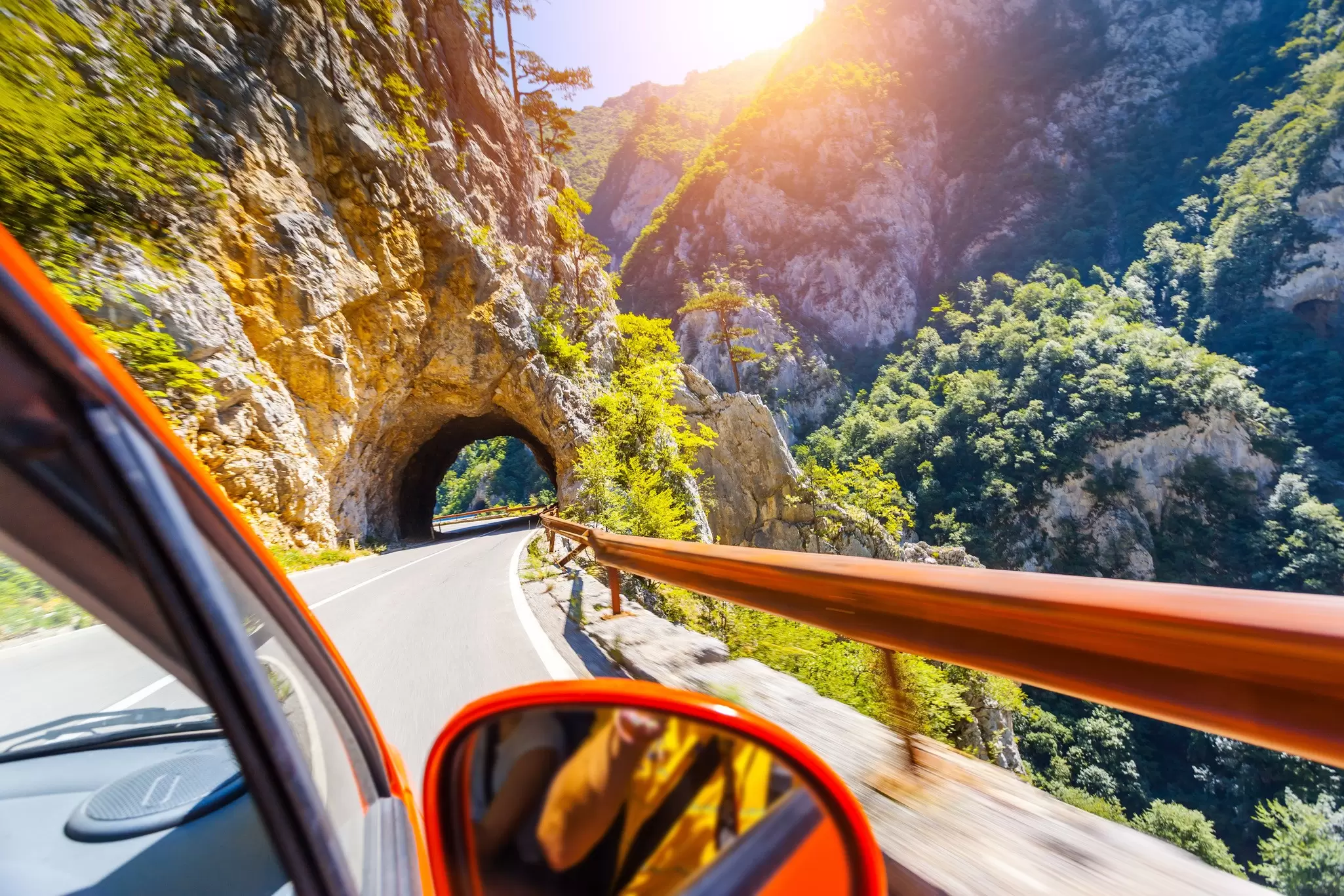 A scenic mountain road winding through the Balkans