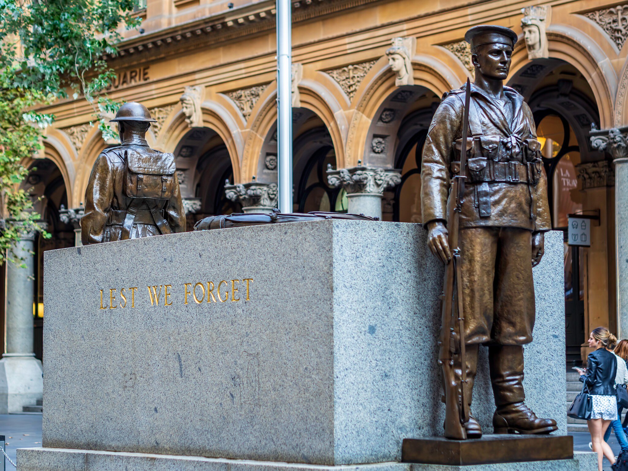 Bronze soldier statues standing guard at the Cenotaph in Martin Place. Cenotaph means `Empty Tomb`. A special remembrance area for Returned Soldiers. Sydney, Australia.