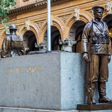 Bronze soldier statues standing guard at the Cenotaph in Martin Place. Cenotaph means `Empty Tomb`. A special remembrance area for Returned Soldiers. Sydney, Australia.