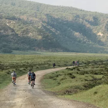 Cyclists ride bikes through Hell's Gate National Park in Kenya  License Type: media  Download Time: 2023-07-13T06:24:40.000Z  User: mvm_lonelyplanet  Is Editorial: No  purchase_order: