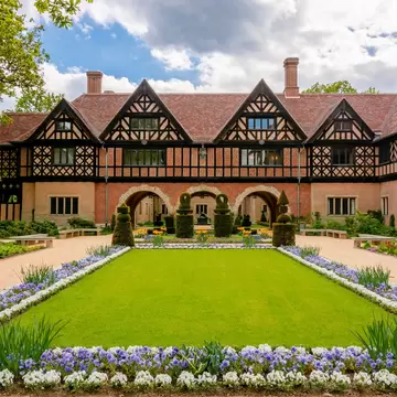 Facade of Cecilienhof palace in New (Neuer) park, Potsdam, Germany.