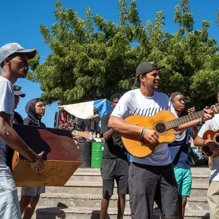 Mindelo, Cabo Verde, Africa, January 04 2024, musicians in the street, License Type: media, Download Time: 2025-10-10T18:28:17.000Z, User: bhealy950, Editorial: true, purchase_order: 65050 - Digital Destinations and Articles, job: Lonely Planet Online Editorial, client: Best islands in Cabo Verde, other: Brian Healy