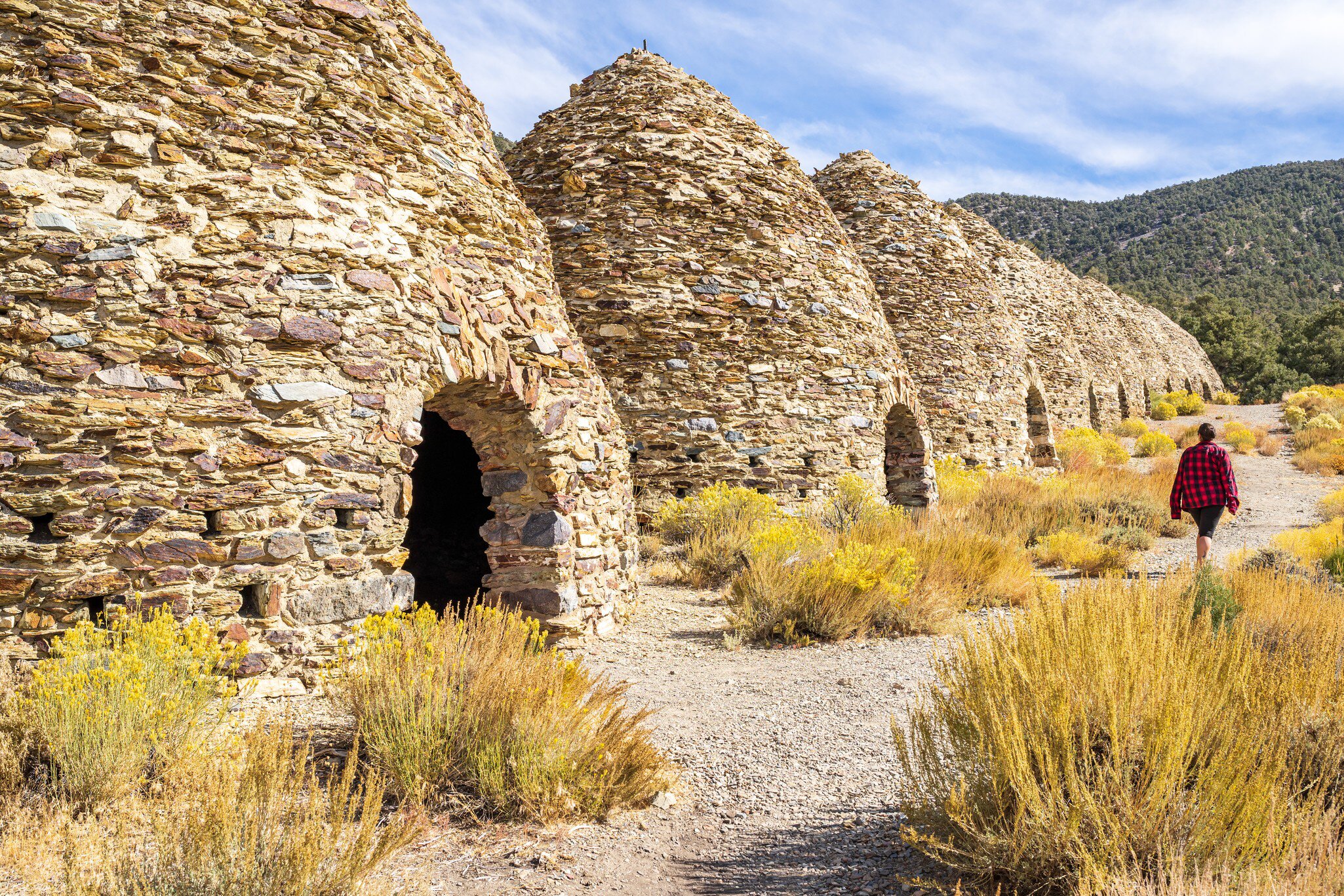 Woman sightseeing at the charcoal kilns in Death Valley National Park.