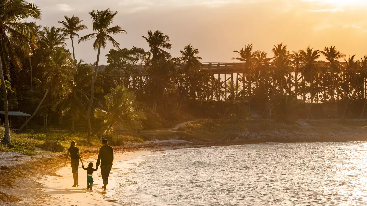 From casual beach strolls to thrilling roller coaster rides, Florida is the perfect family destination © Natalia Bratslavsky / Shutterstock