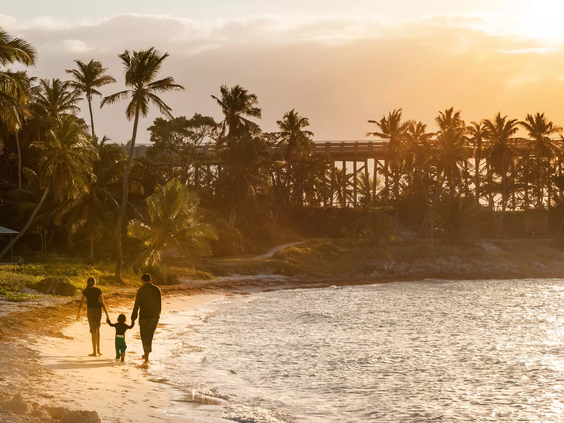 From casual beach strolls to thrilling roller coaster rides, Florida is the perfect family destination © Natalia Bratslavsky / Shutterstock