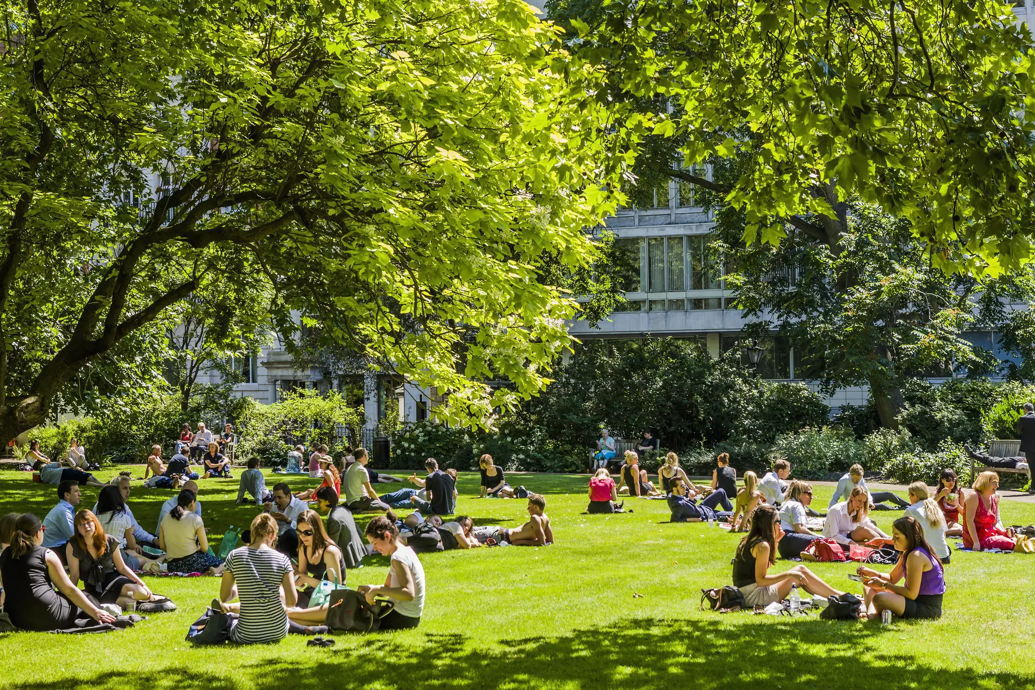 Summer brings the best weather to London and is the best time to lounge in one of its many green spaces © Maremagnum / Getty Images