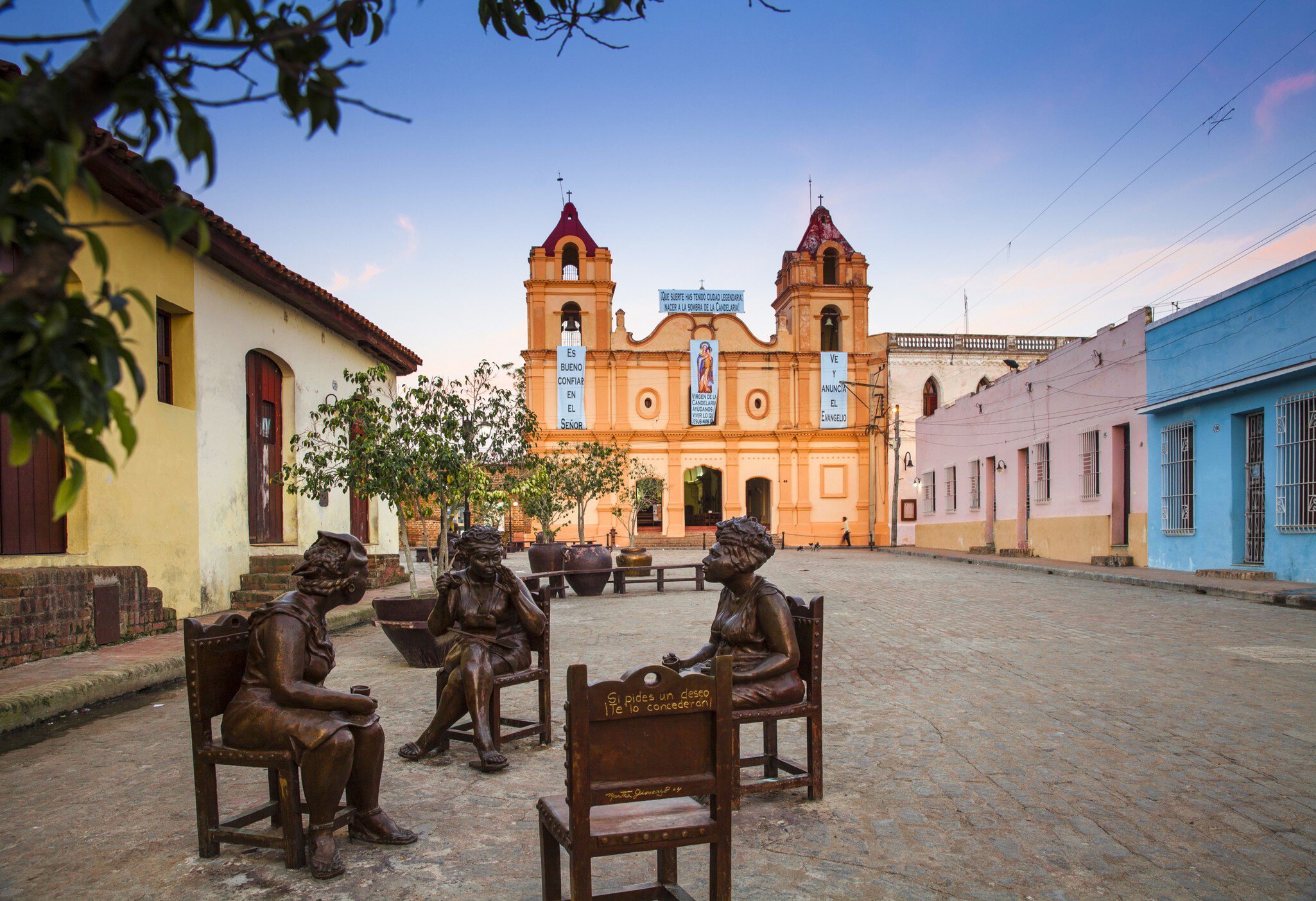 Cuba, Camaguey, Camaguey Province, Plaza Del Carmen, Iglesia de Nuestra Senora del Carmen and Unique life-sized sculptures of camagueyanos going about their daily life