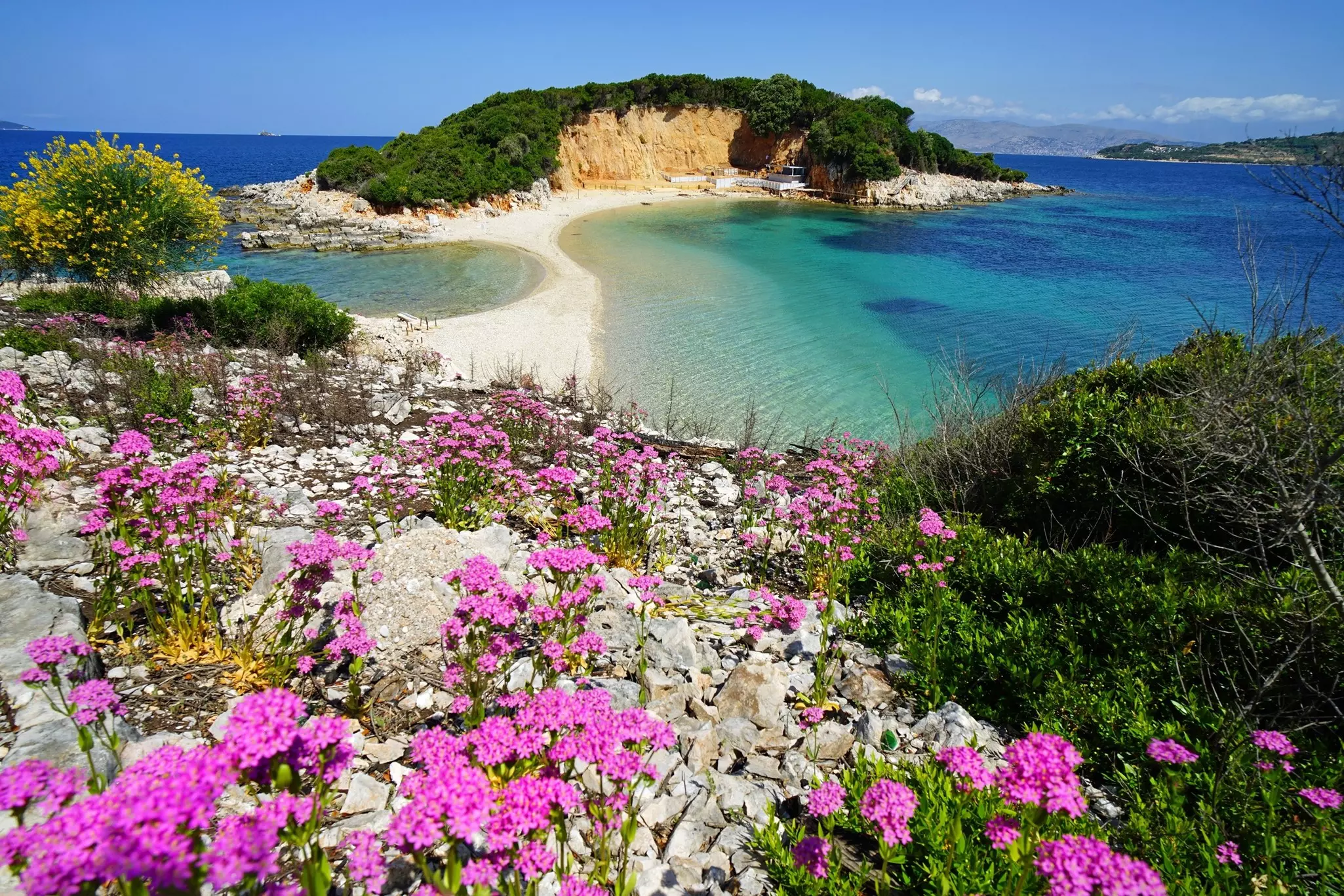 Aerial view of the Twin Islands of Ksamil in southern Albania which are connected to one another via a narrow sand belt.