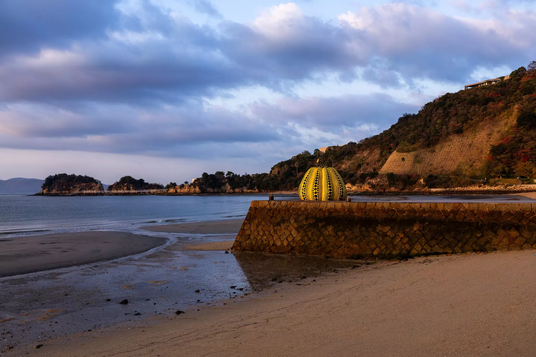 Kusama’s Pumpkin, a spotted yellow squash located on a short jetty just past the Benesse House grounds on Naoshima Island, Japan.