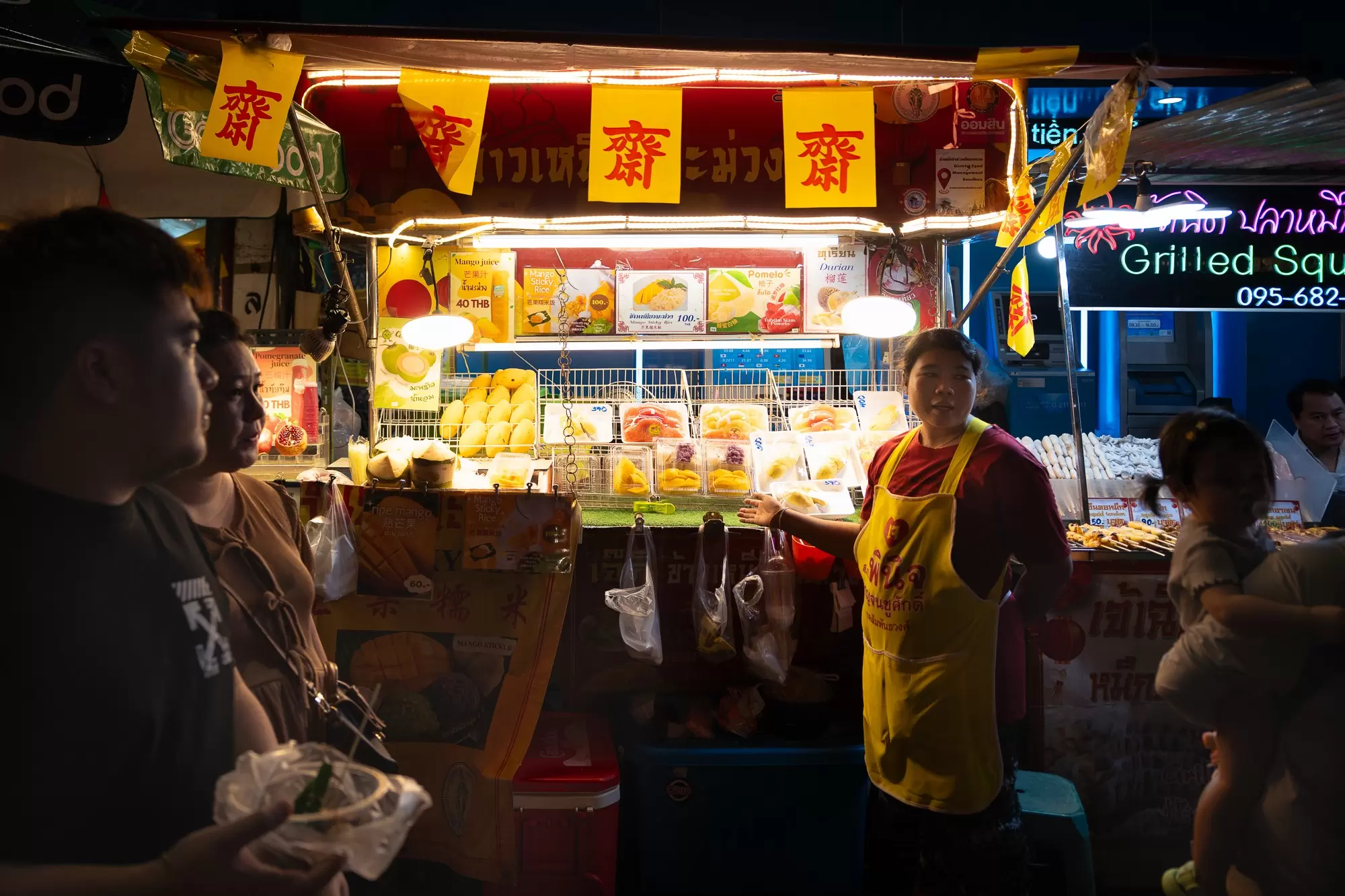 A street food vendor in Bangkok's Chinatown at night.