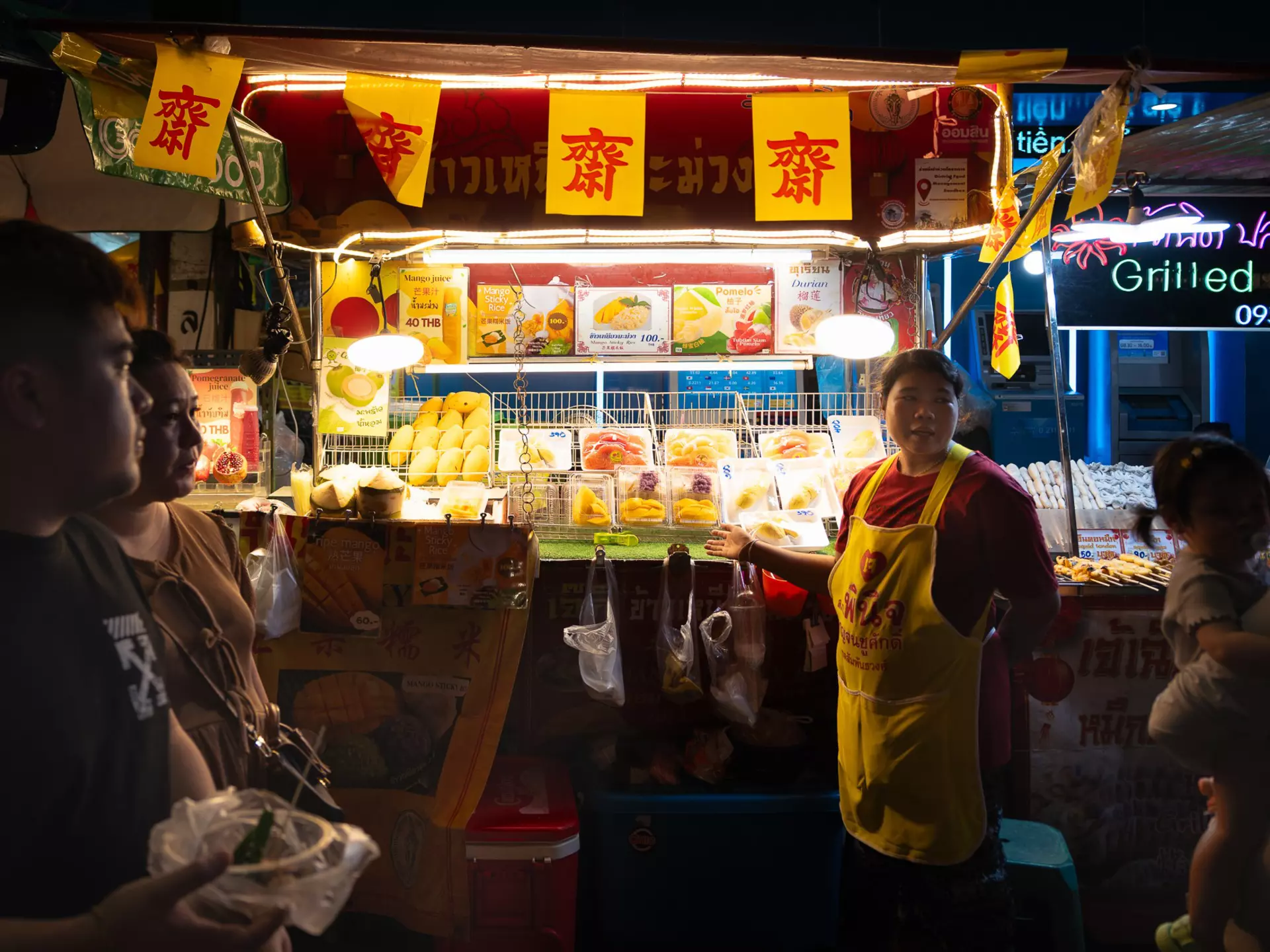 A street food vendor in Bangkok's Chinatown at night.