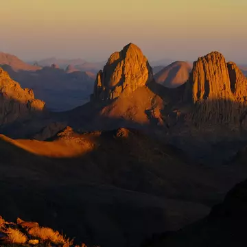 Sunlight over Assekrem, Algeria. Elias Temer/Shutterstock