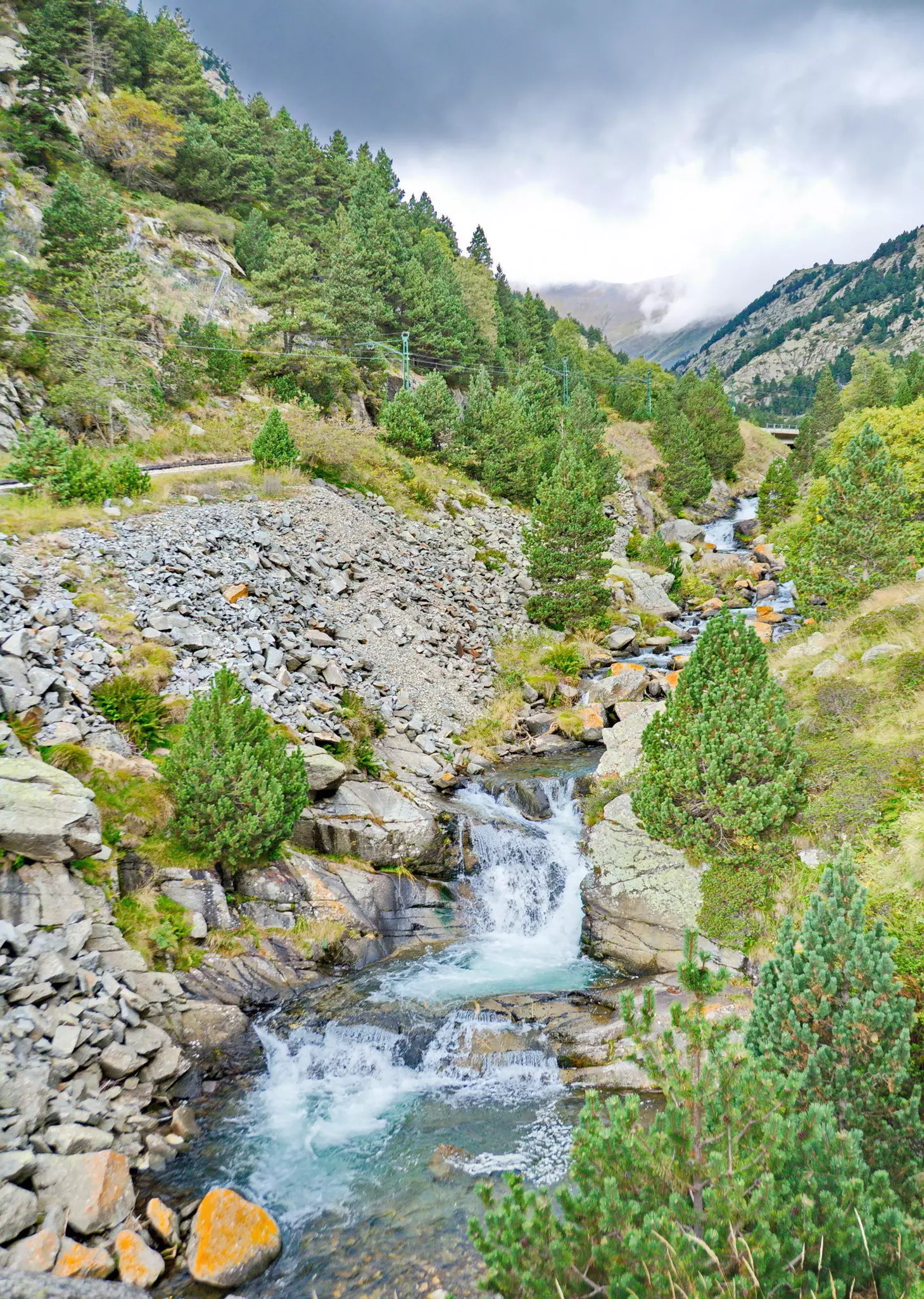 Cascade waterfalls in the valley of Vall de Nuria in the Pyrenees Mountains in Catalonia, Spain