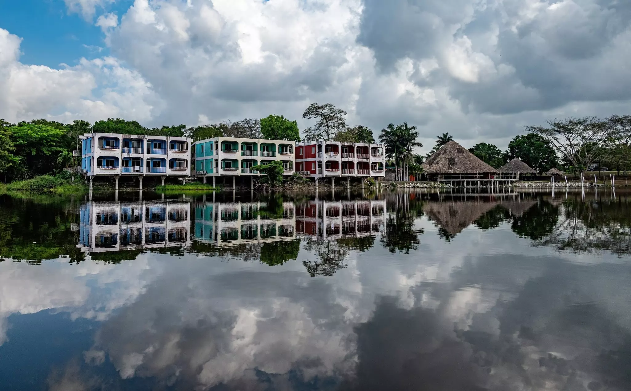 Low, colorful hotel reflected in water
