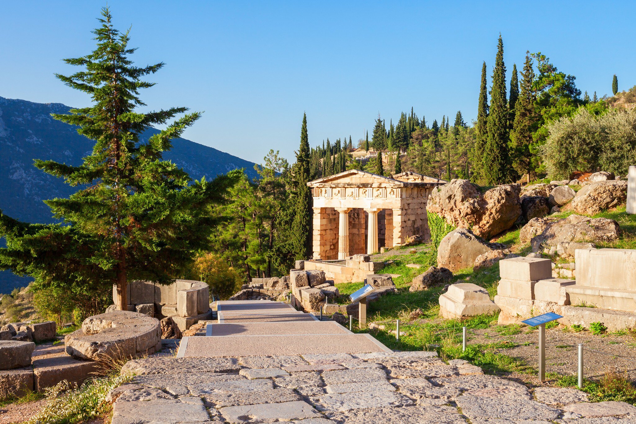 View of the Athenian Treasury at Ancient Delphi in Greece.