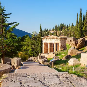 View of the Athenian Treasury at Ancient Delphi in Greece.