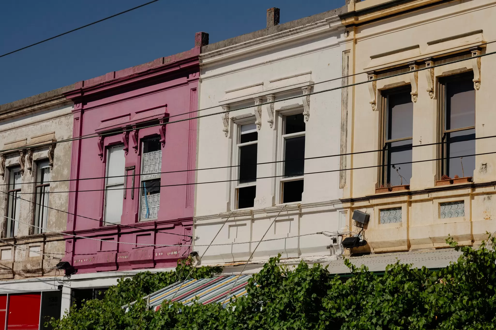 A Melbourne high street of colorful terraces. 