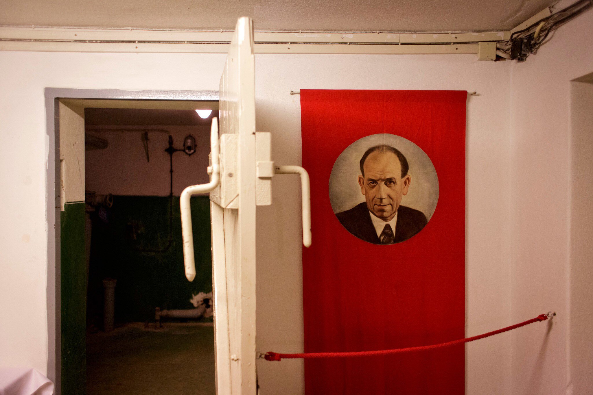 A shelter door and a portrait of Czechoslovakian President Antonin Zapotocky are displayed as part of an exhibition at the Cold War-Era nuclear shelter inside the Hotel Jalta on Wenceslas square in Prague, Czech Republic. 