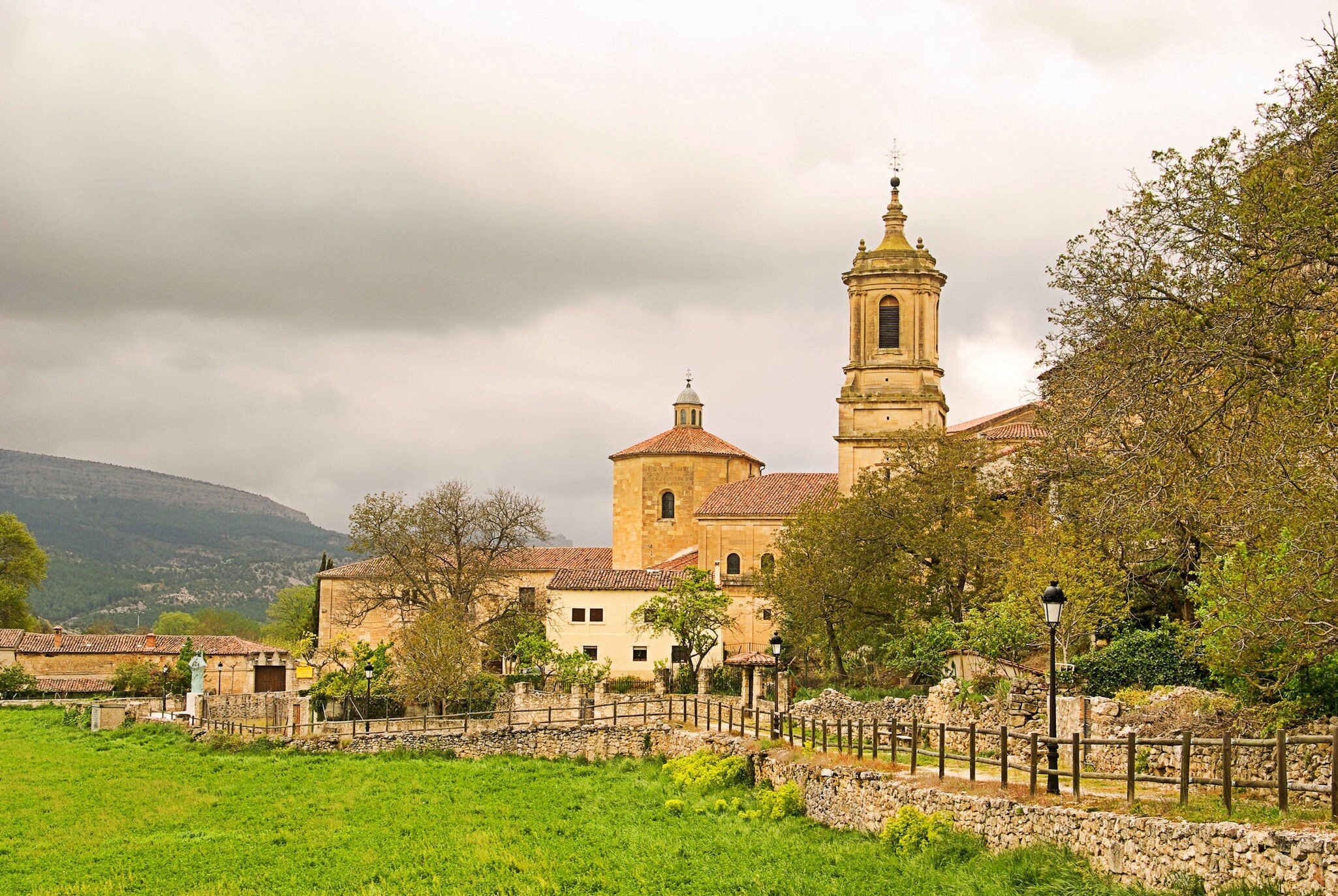 View of the tower and monastery complex of Abadía de Santo Domingo de Silos in Spain.