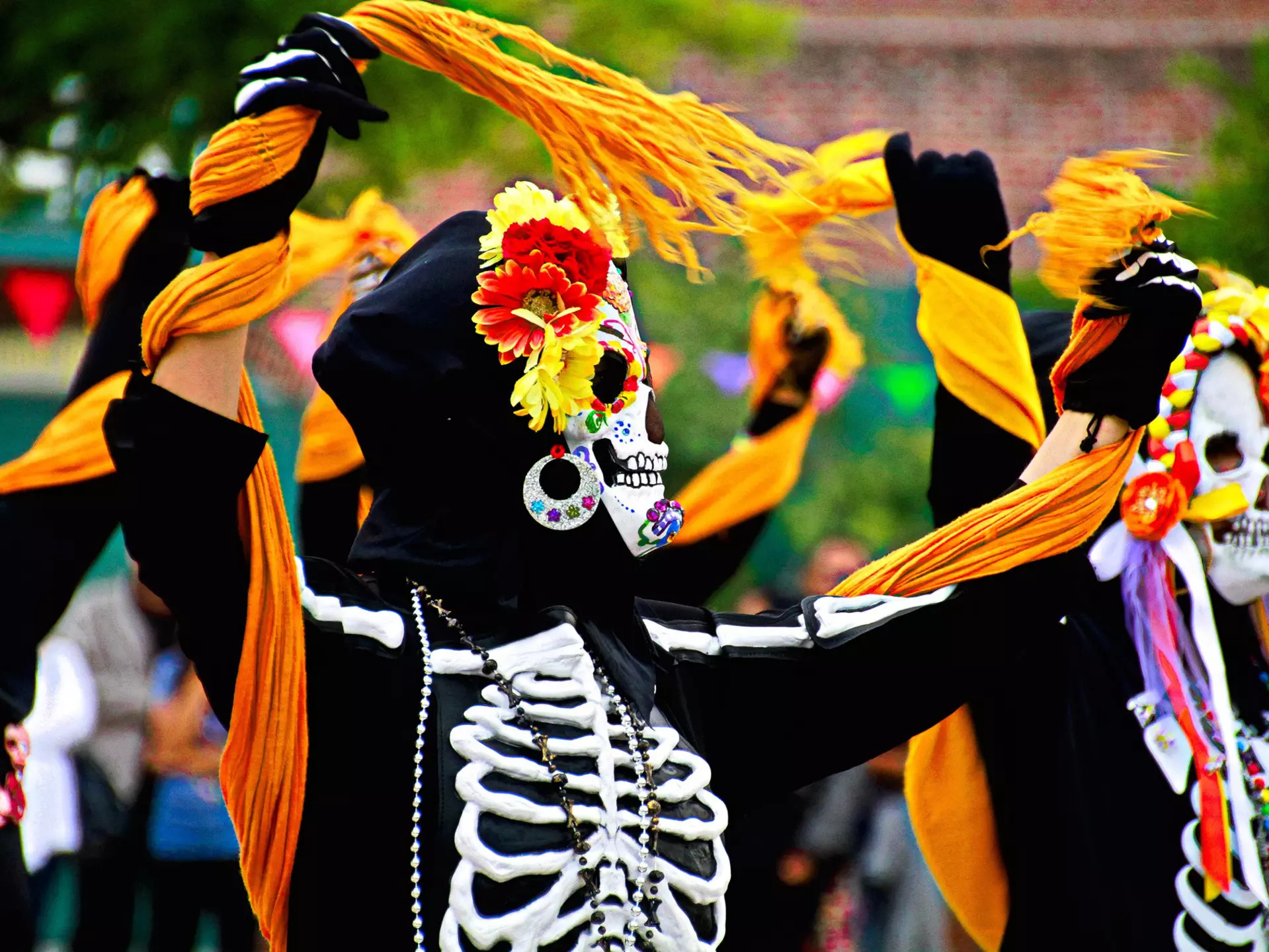 A procession of people dressed as skeletons for Día de Muertos in Los Angeles, USA.