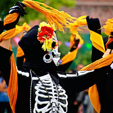 A procession of people dressed as skeletons for Día de Muertos in Los Angeles, USA.