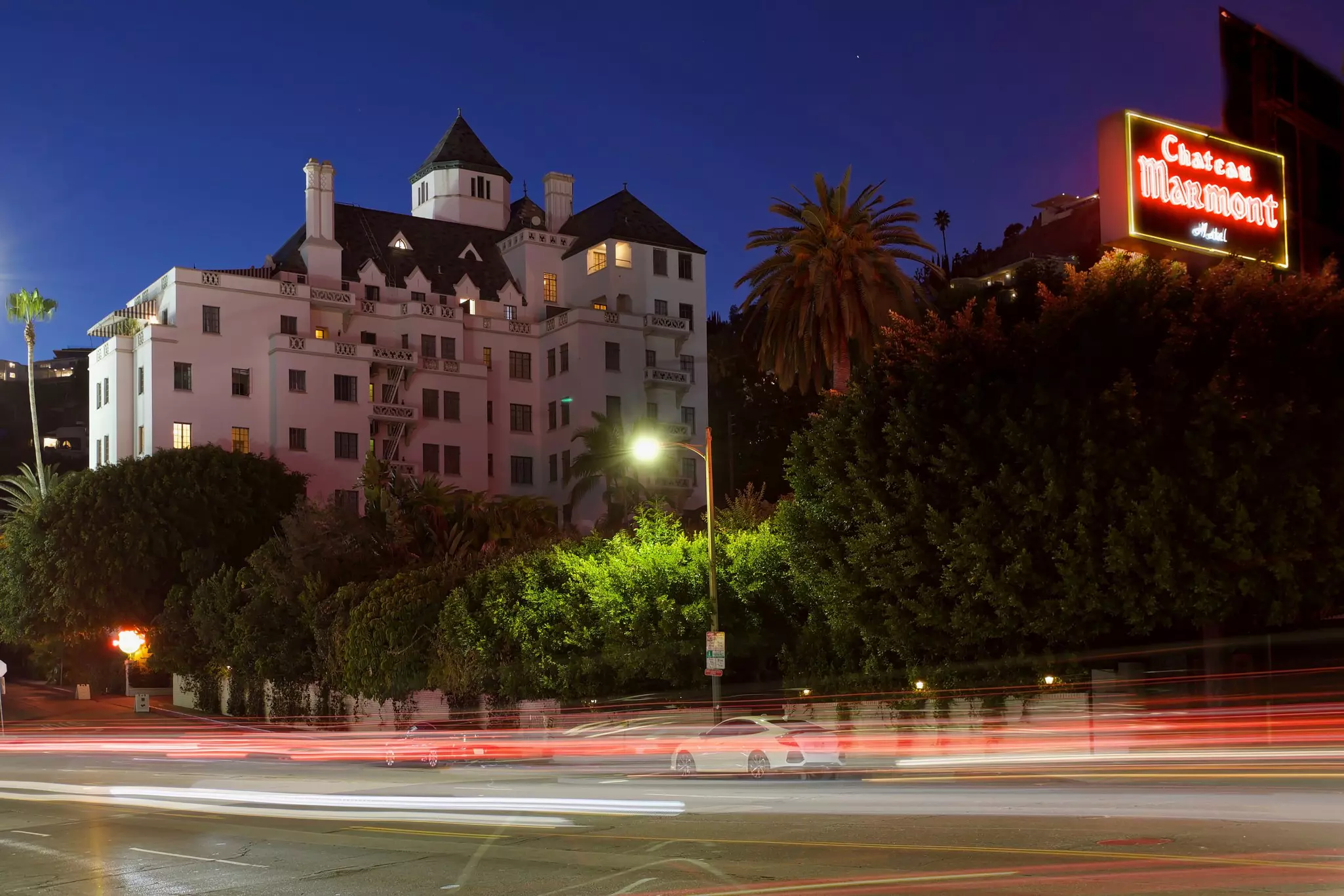The exterior of Chateau Marmont hotel with blurred cars passing by, Los Angeles, California, USA