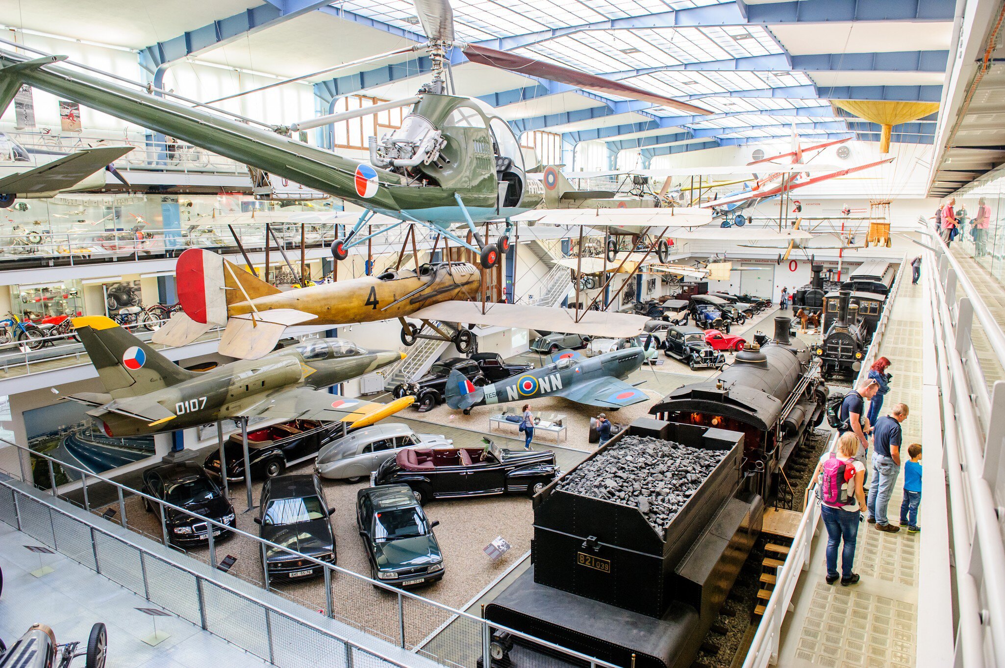 Interior of National technical museum in Prague, Czech republic, with museum-goers.