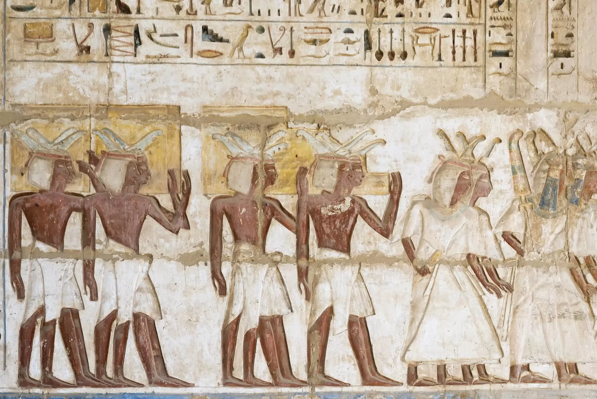 Ancient Egyptian hieroglyphs carved in stone