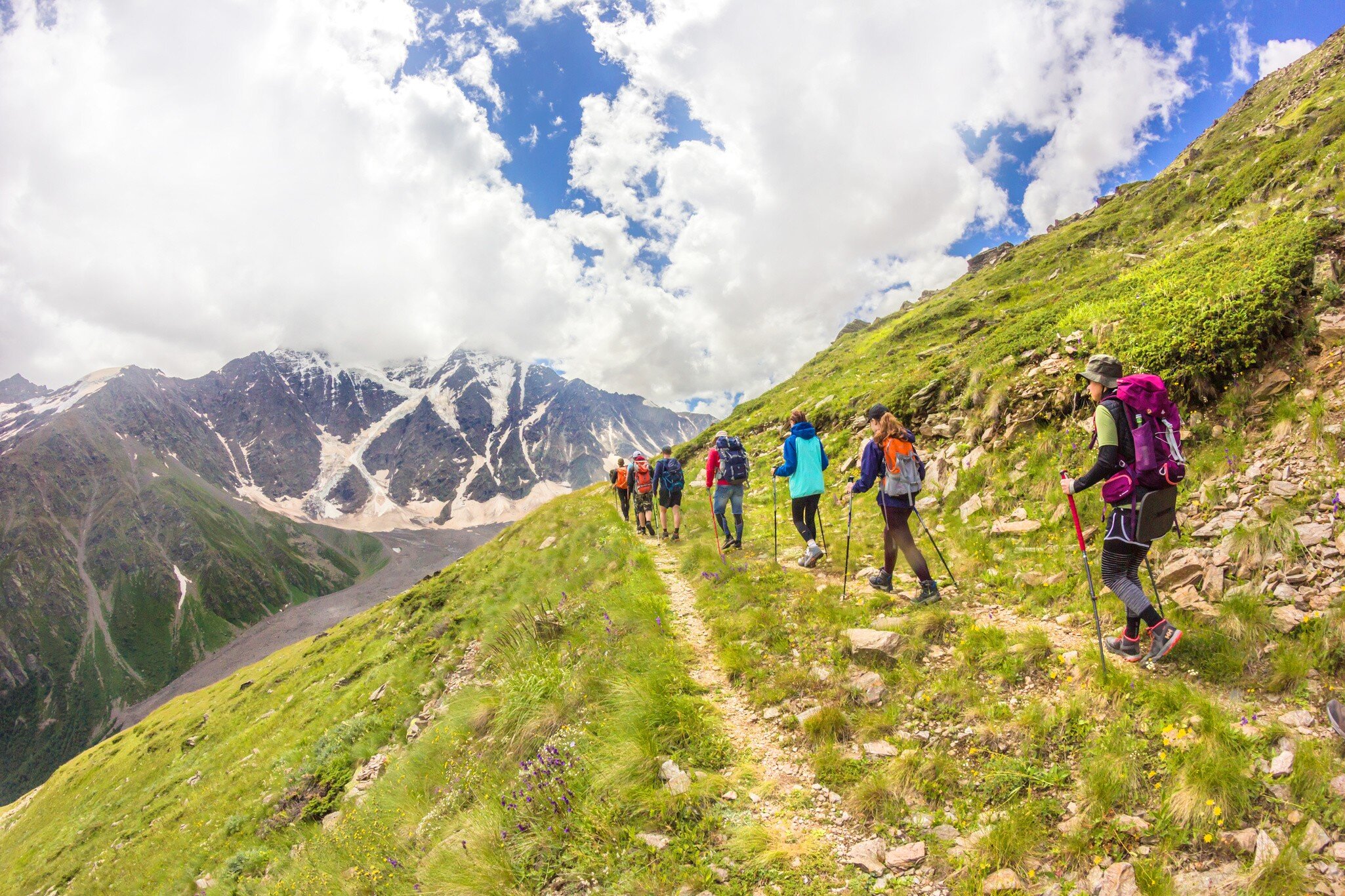 JULY 29, 2018: A group of climbers follow each other in a chain while climbing Mt Elbrus.