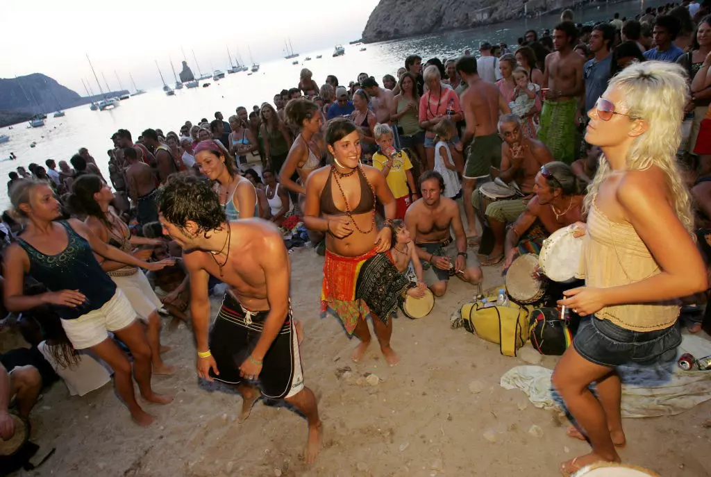 People dancing, Sunset beach party, Benirras Beach, Ibiza, July 2006. (Photo by Tristan Fewings/PYMCA/Avalon/Getty Images)
175222255
2000s, 20s, Adults, Attractive, Beach, Beach Parties, Caucasian, Cute, Dancers, Dancing, Drummers, Drumming, Enjoy, Enjoying, Enjoyment, Ethnic, Europeans, Evening, Exotic, Female, Fun in the Sun, Girl, Girls, Good Looking, Groups, Guys, Happiness, Happy, Health, Healthy, Hippies, Hippy, Holiday makers, Holiday-makers, Holidaymakers, Holidays, Ibiza, Joy, Joyful, Locations, Male, Man, Mediterranean, Men, Music, Ocean, On the Beach, Outdoors, Outside, Parties, Party, Partying, People, Percussion, Pretty, Sand, Sarong, Sea, Small Crowds, Smiling, Summer, Sunset, Suntanned, Tanned, Travelling, Vacations, Vitality, White, Woman, Women, Young
People dancing, Sunset beach party, Benirras Beach, Ibiza, July 2006.