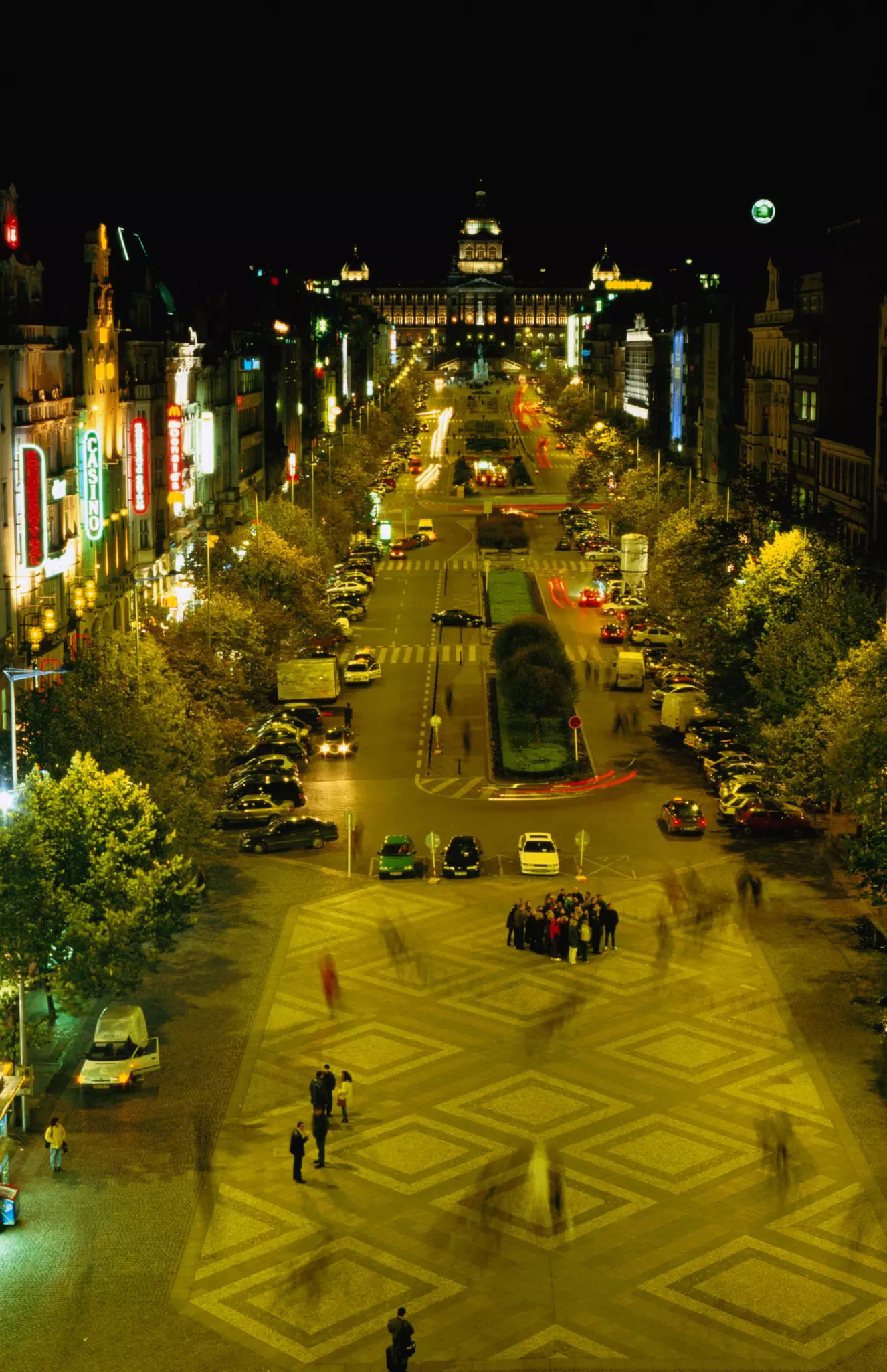 A bustling city square at night