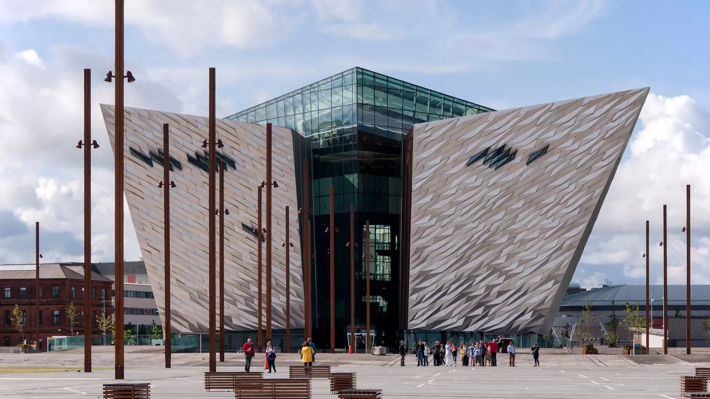A museum in Belfast's Titanic Quarter has two angled wings and glass-enclosed center.