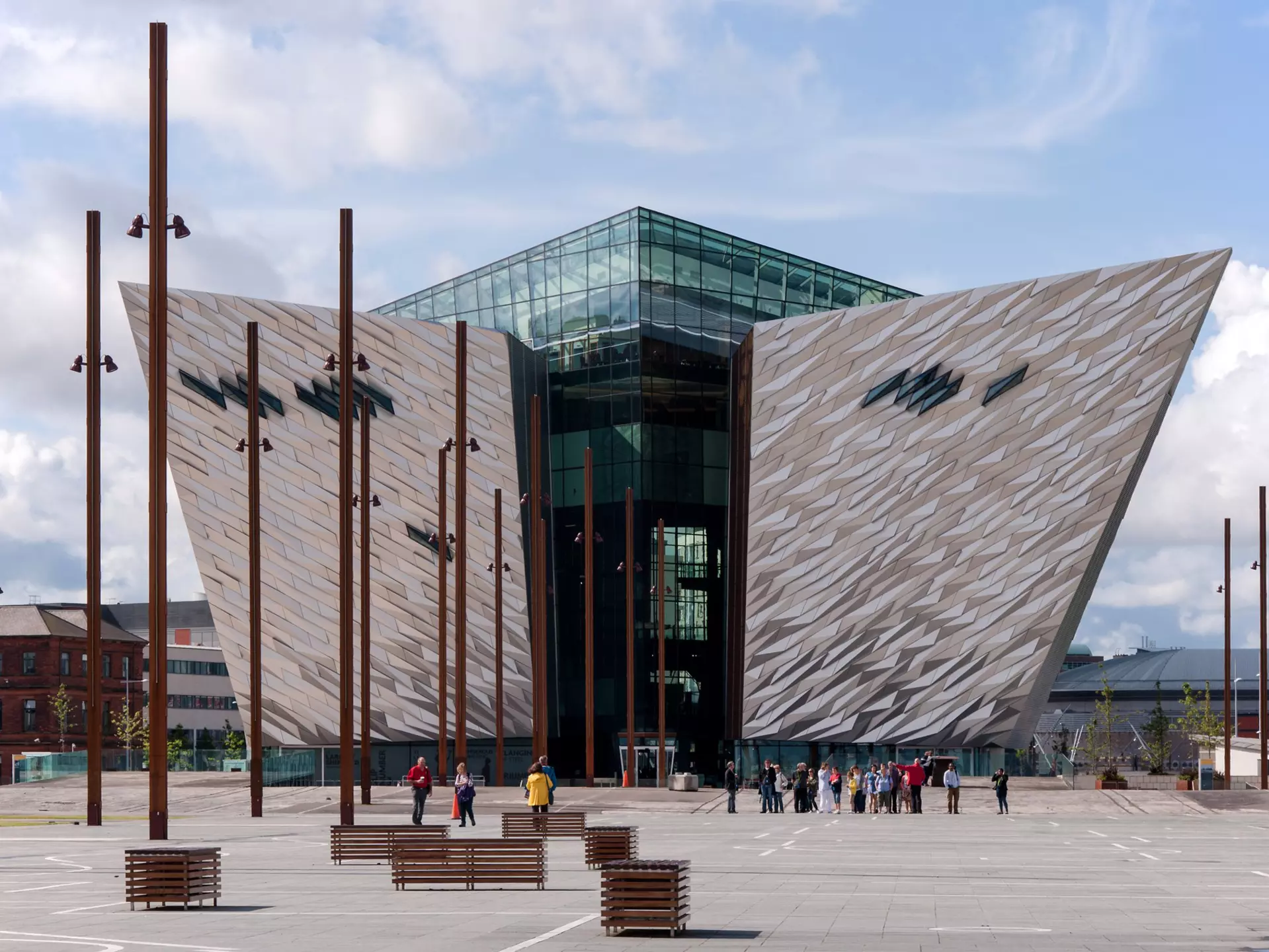 A museum in Belfast's Titanic Quarter has two angled wings and glass-enclosed center.