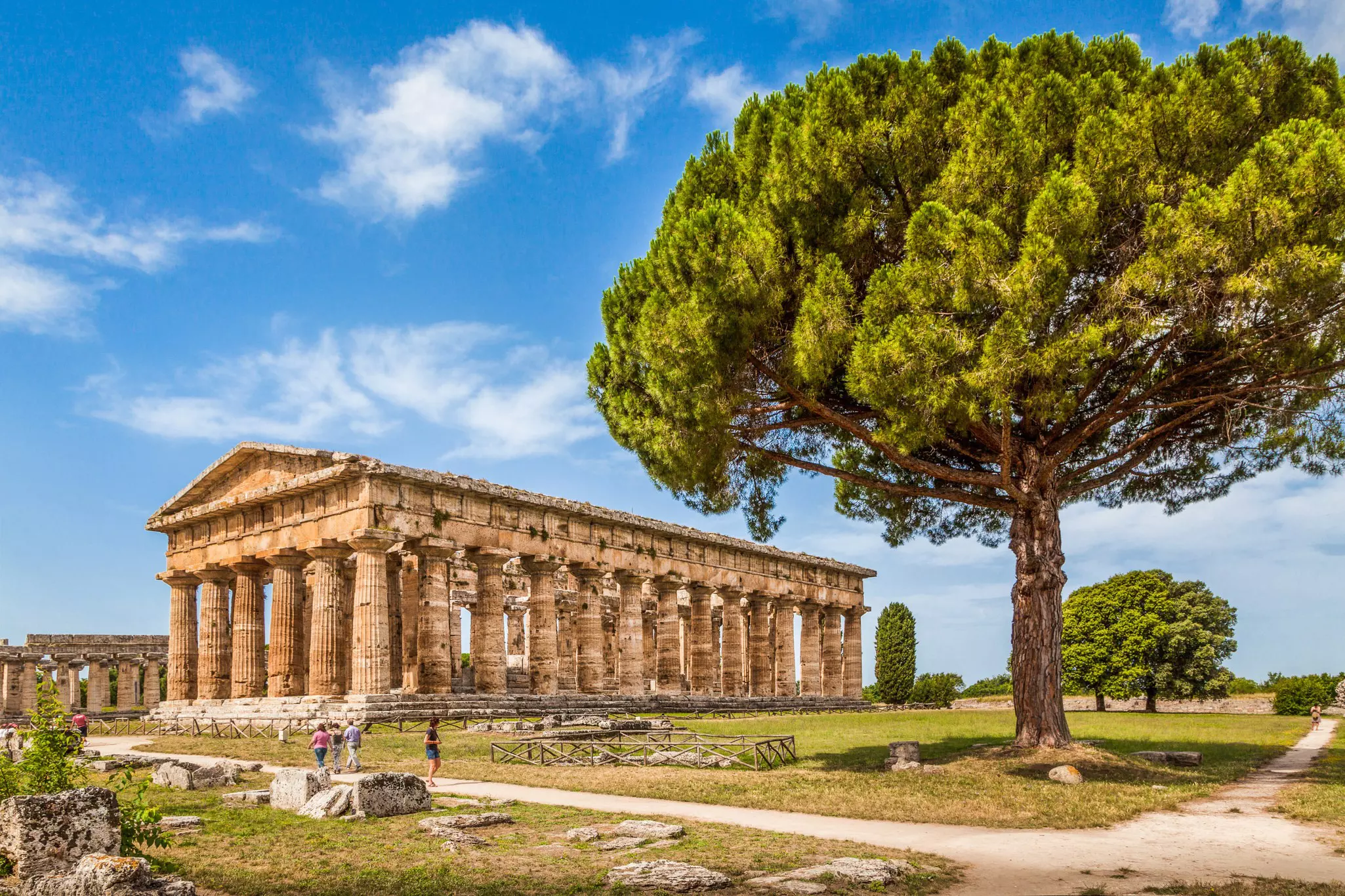 A vast ancient temple with Doric columns supporting a triangular roof