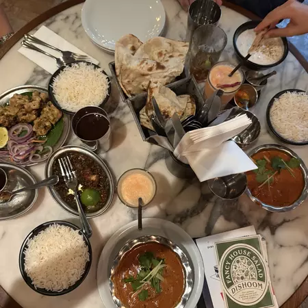 A spread of plates at Dishoom in Shoreditch, London