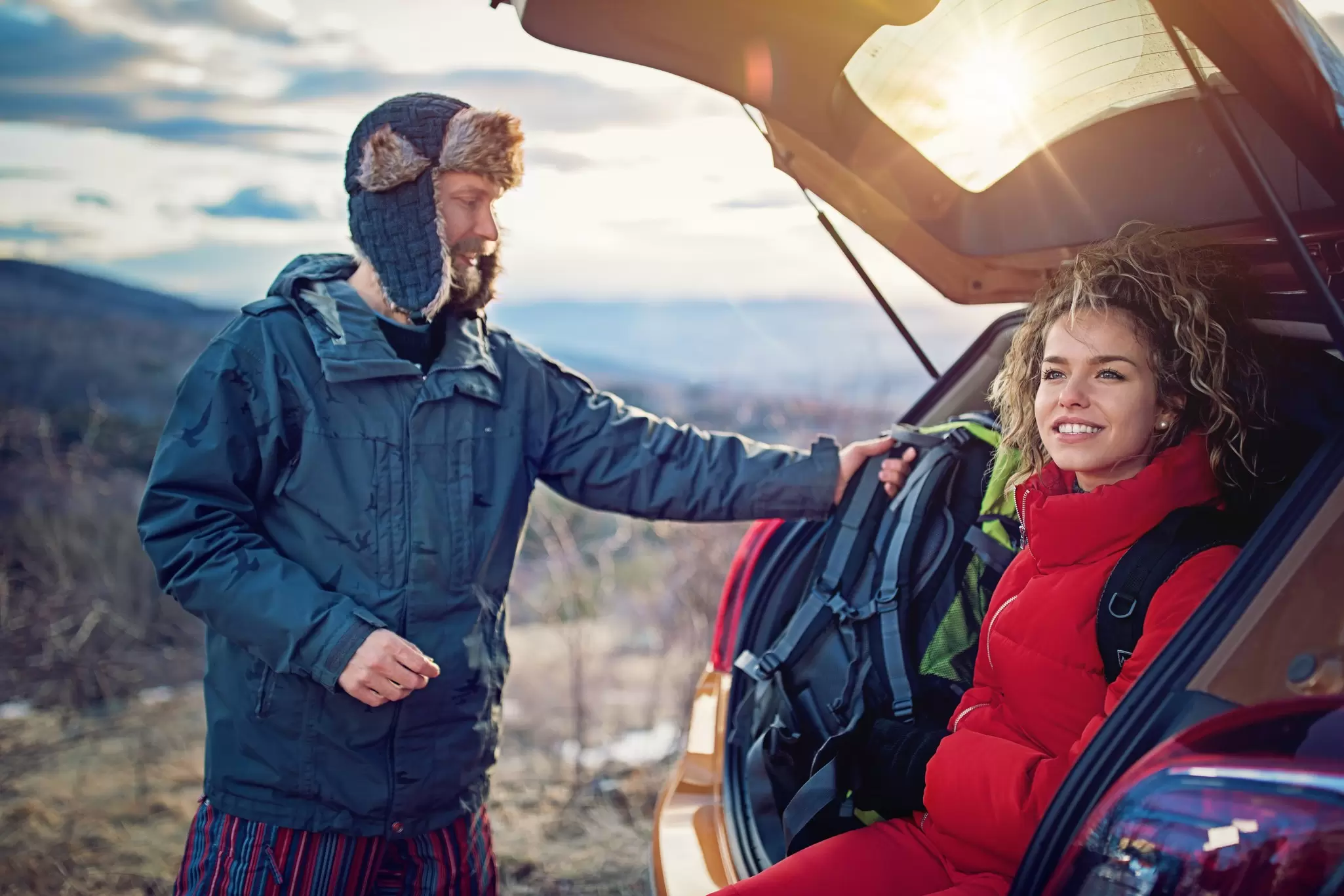 A hiking couple resting in the mountains