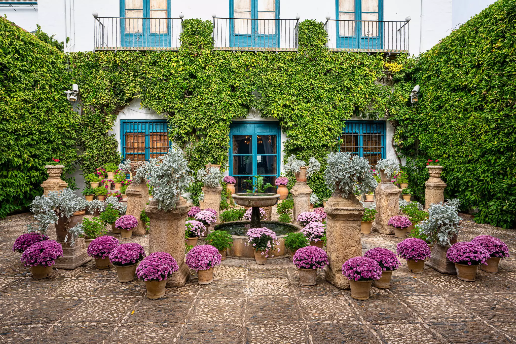 Courtyard garden of Viana Palace in Cordoba, Andalusia, Spain. Built in XV century. Viana Palace is a tourist attraction known for its 12 magnificent patios and gardens.