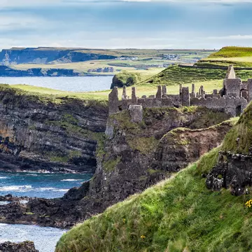 The ruins of Dunluce Castle atop the sea cliffs at Magheracross, Northern Ireland