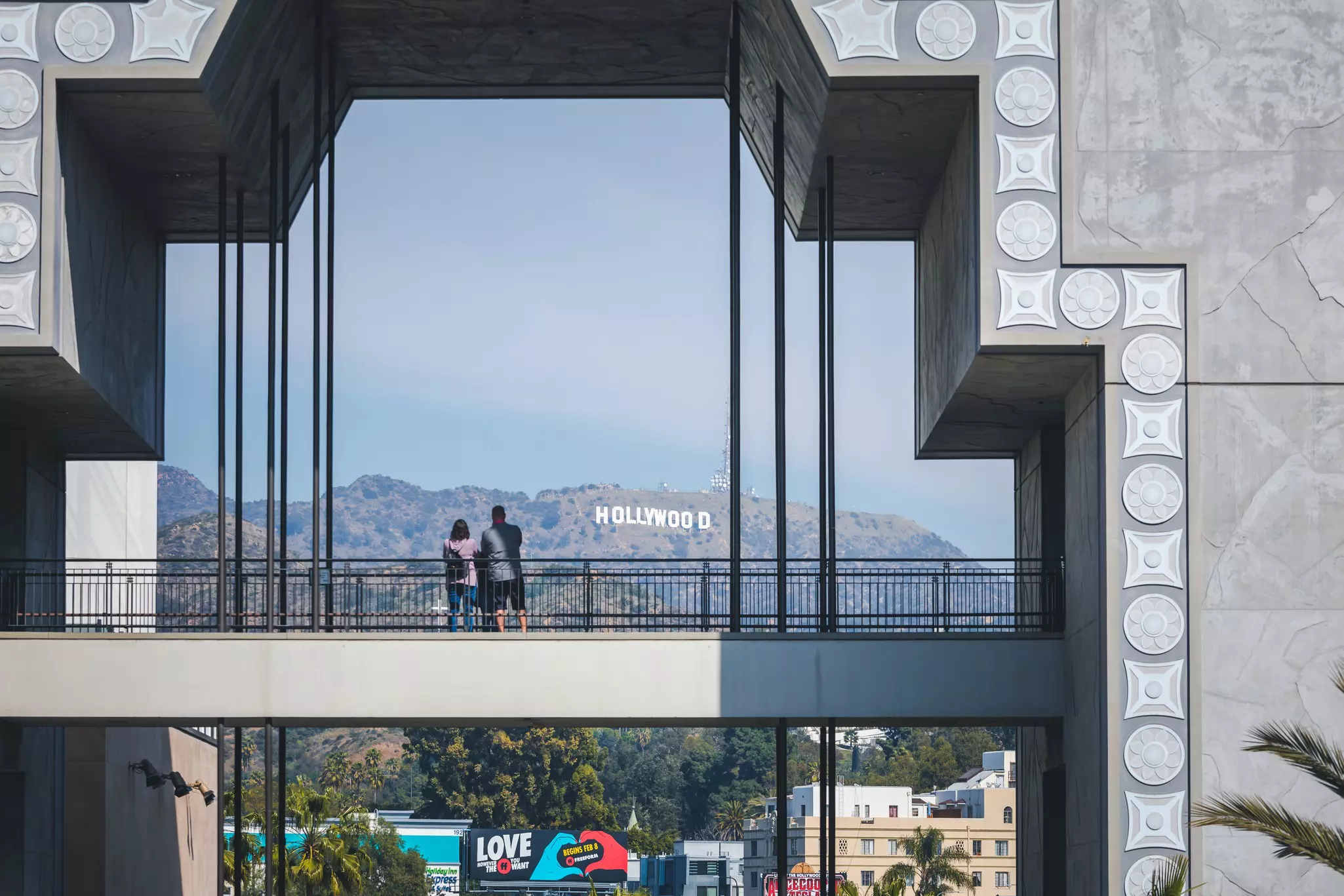 A couple looking at the Hollywood sign 